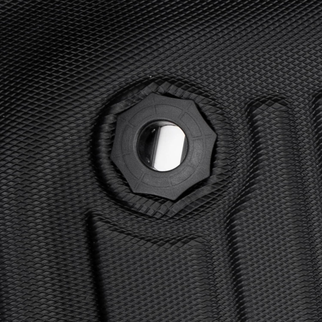Close-up of black rubber floor mat with circular mounting hole and textured border