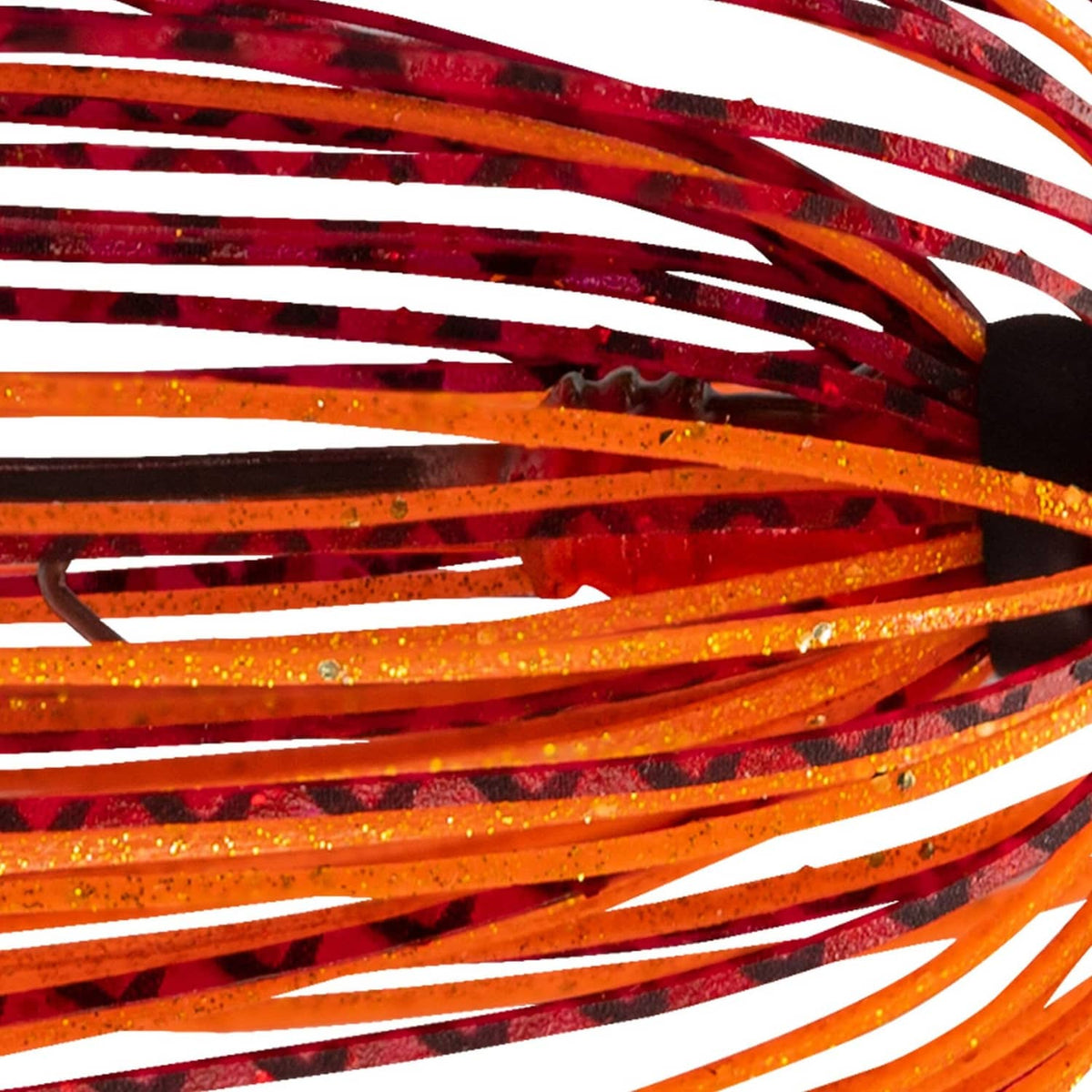Close-up of orange and red-striped fishing lure skirt strands with glitter