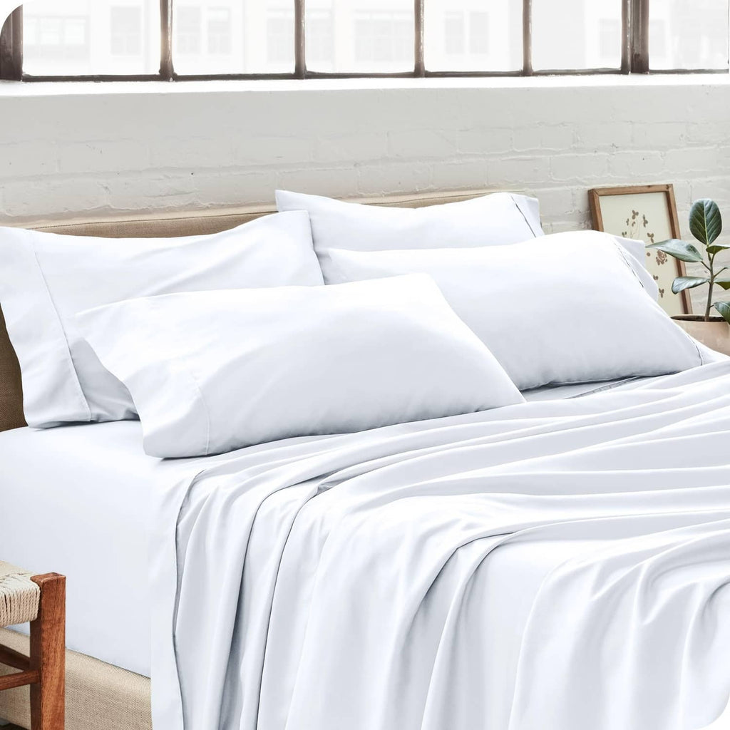 White pillowcases on a bed with two fitted pillow envelopes and clean seams