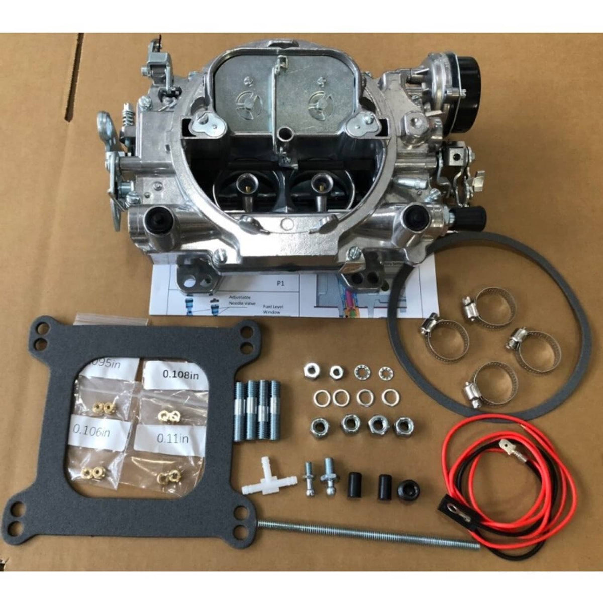 Four-barrel carburetor kit with gasket, screws, rings, and red wiring harness components.