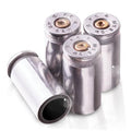 Four nickel bullet tire valve stem caps with black inner opening and metal cores