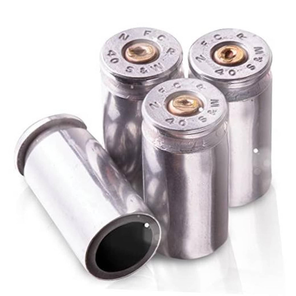 Four nickel bullet tire valve stem caps with black inner opening and metal cores