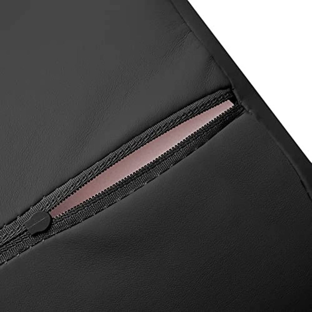 Black massage bolster pillow with zipper seam and fabric strap detail