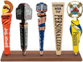 Brown wooden beer tap handle display stand with multiple decorative tap handle signs
