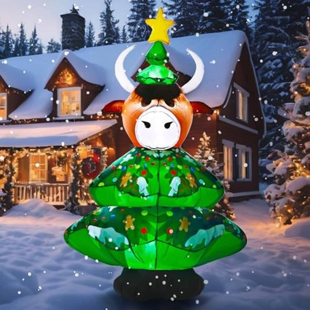 Inflatable highland cow with green Christmas tree outfit, star topper, and glowing multicolor lights