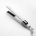 White hair flat iron straightener with black heating plates and power cord.