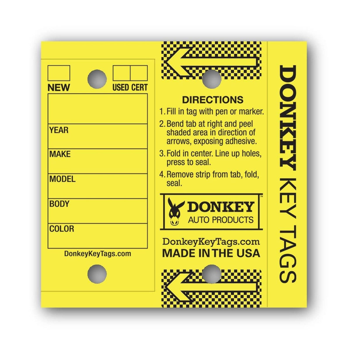 Close-up of yellow laminated key tag with directions and fields for year, make, model, color