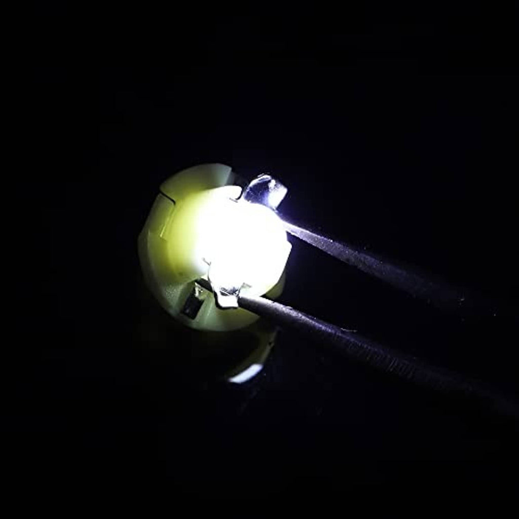 Single T5 LED dashboard bulb glowing bright white from a white plastic base