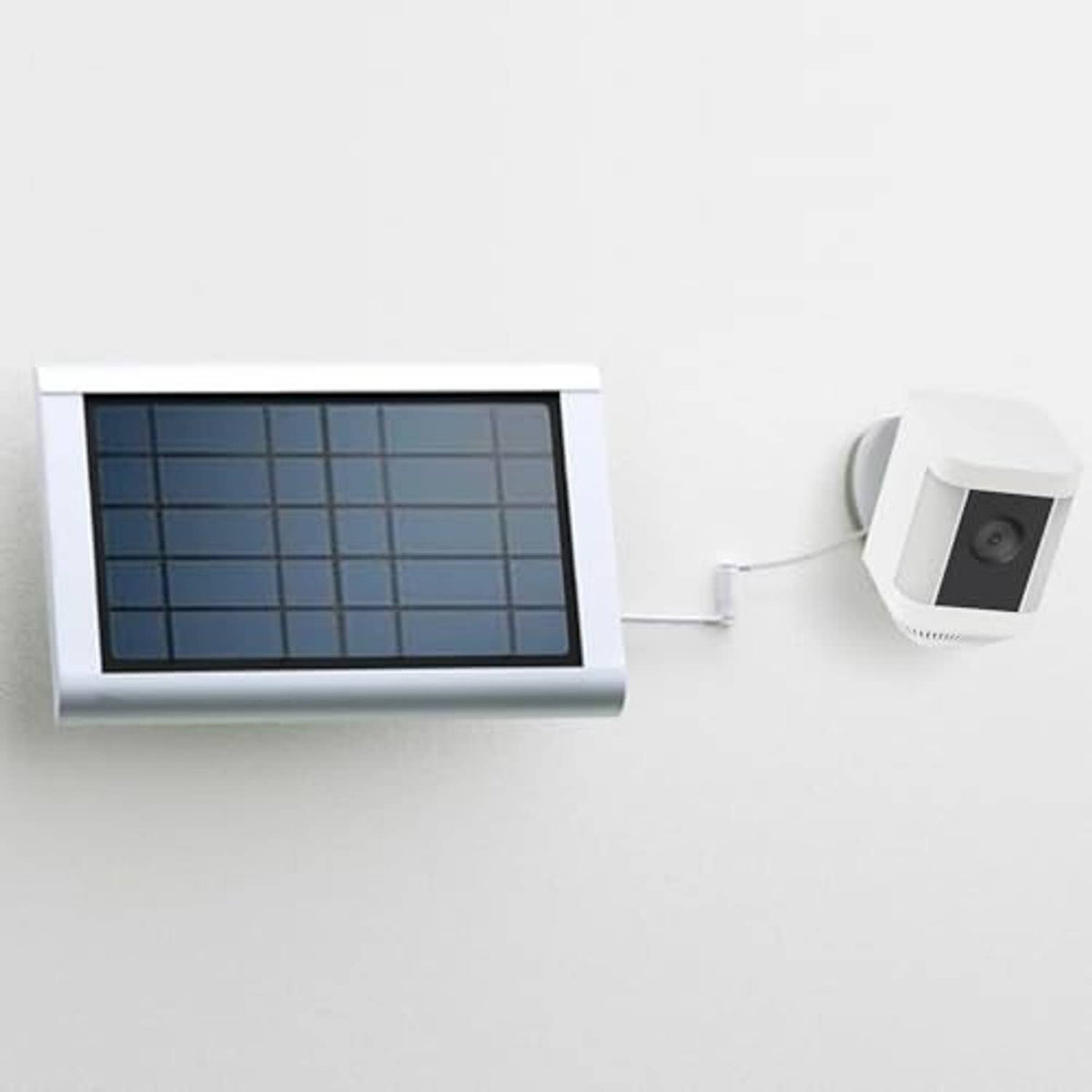 White DC barrel-to-USB-C charging setup with solar panel and device power plug