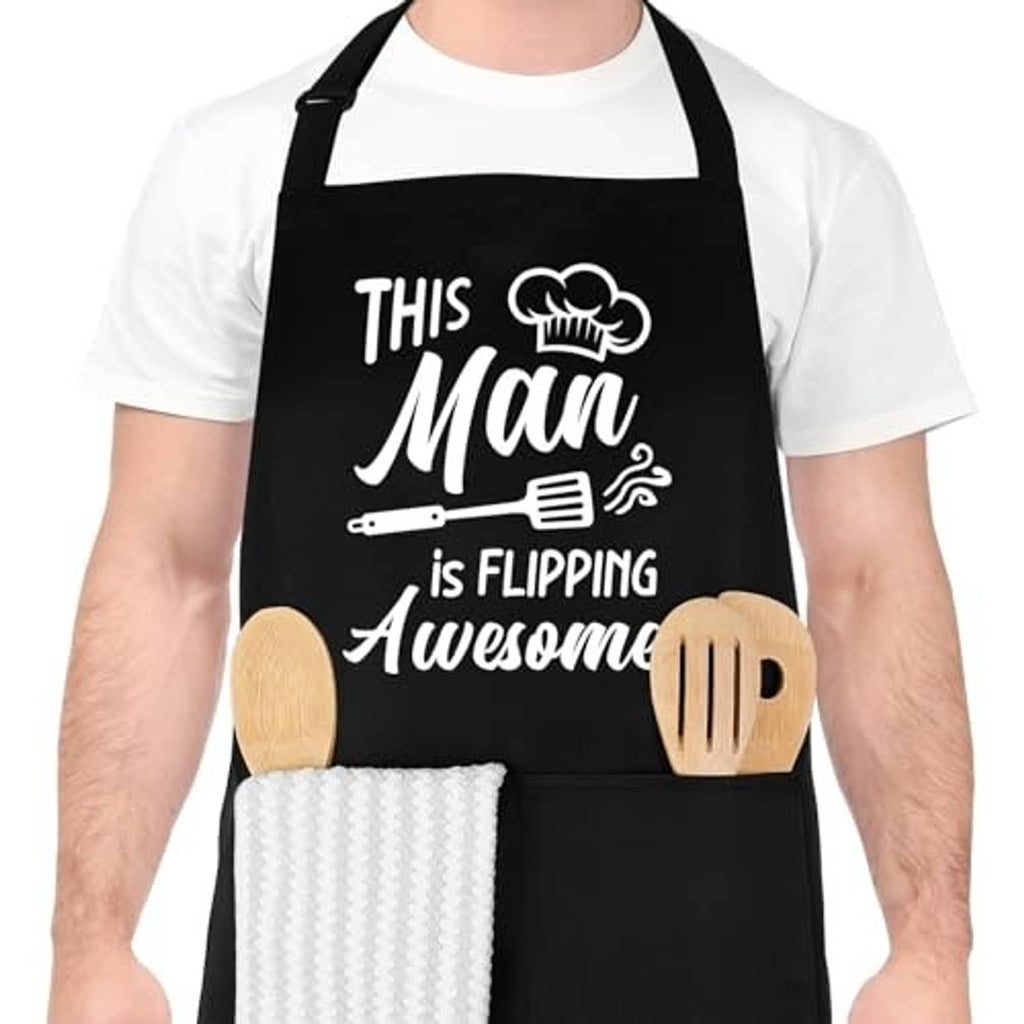 Black kitchen apron with humorous 'This Man is Flipping Awesome' front design