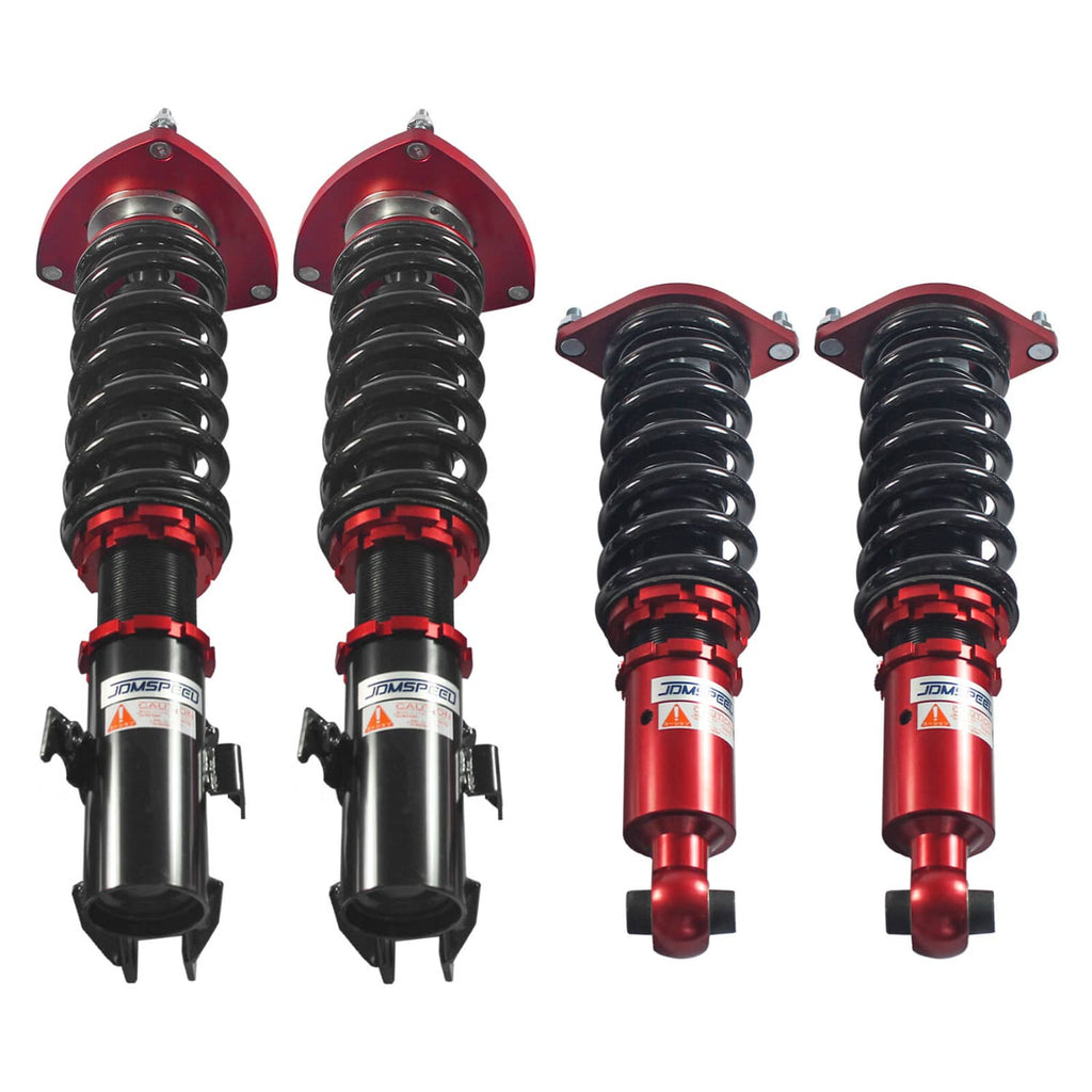 Adjustable coilover strut set with red top plates, black bodies, and black springs