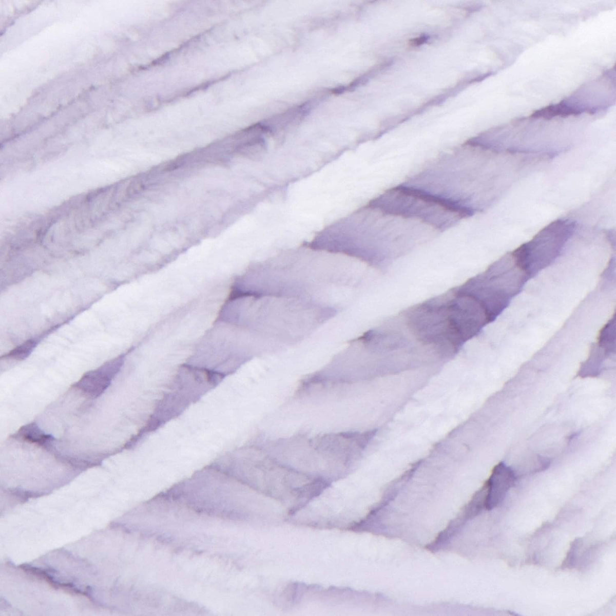 Close-up of lilac velvet yarn strands with soft, fuzzy texture