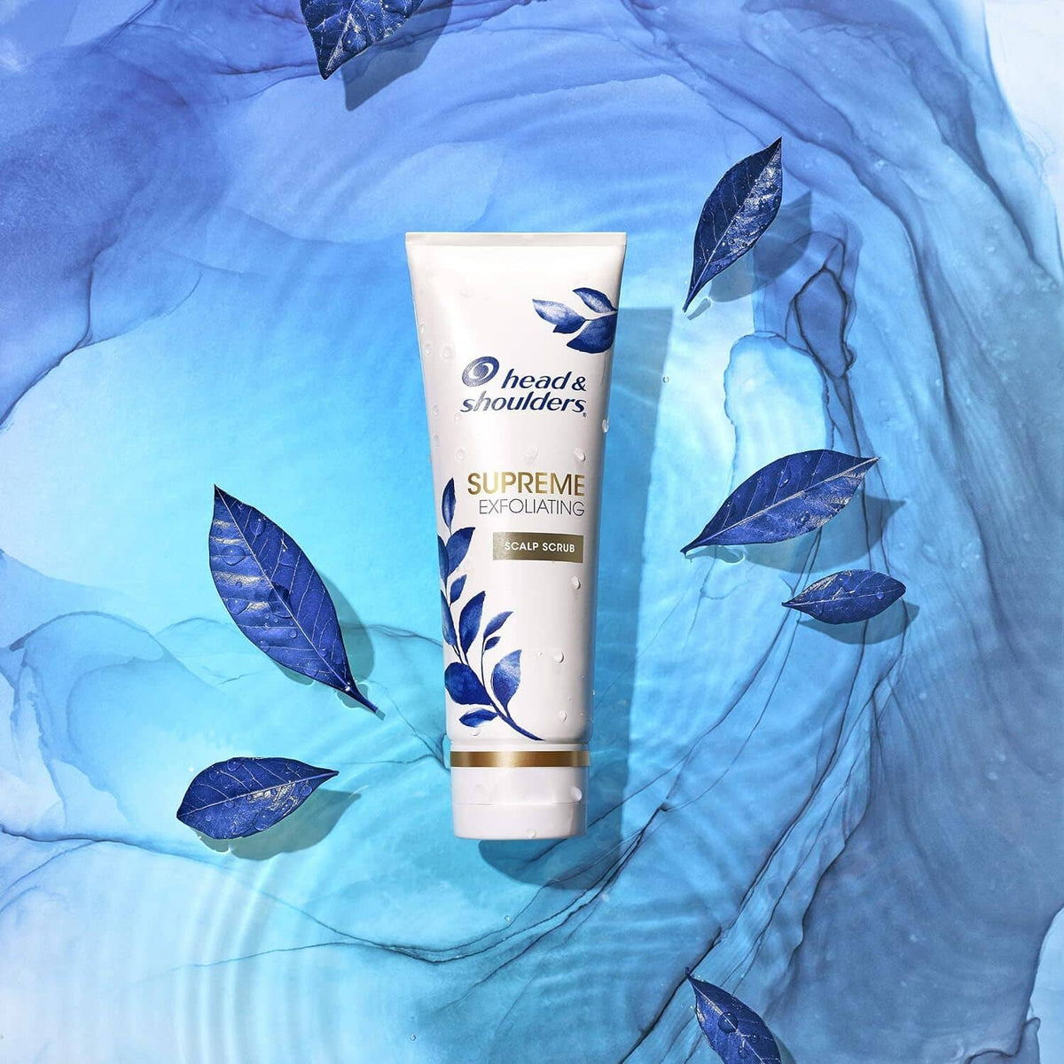head & shoulders Supreme exfoliating scalp scrub tube on blue textured background