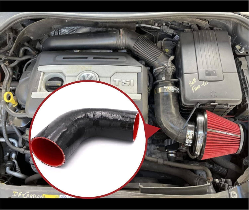 Black 90-degree silicone intake hose elbow installed in engine bay, red-lined end