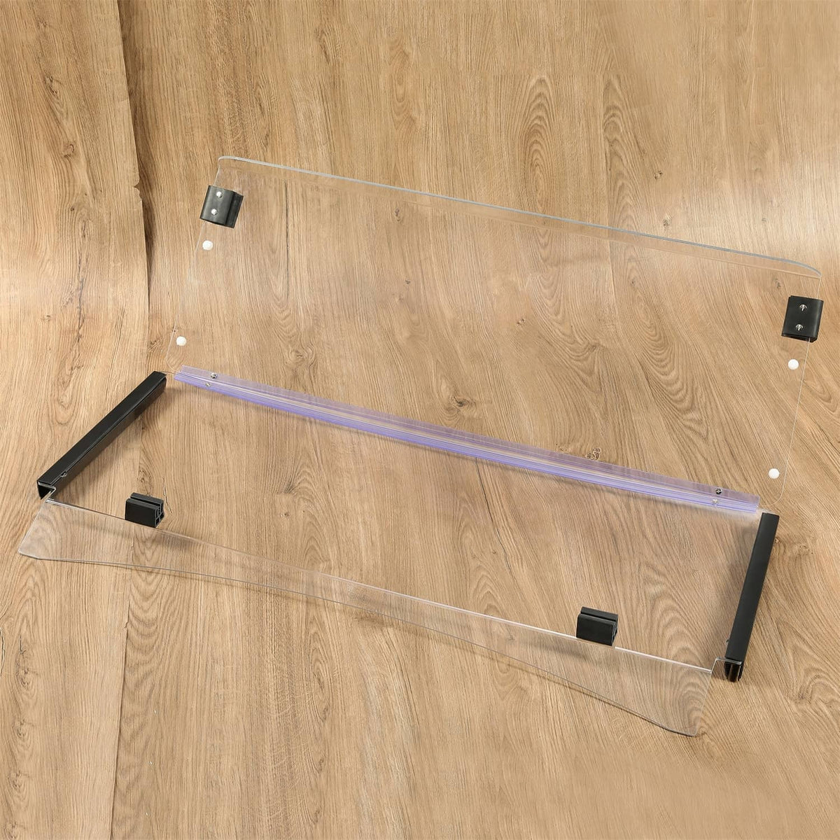 Clear folding golf cart windshield with black mounting feet and blue support bars