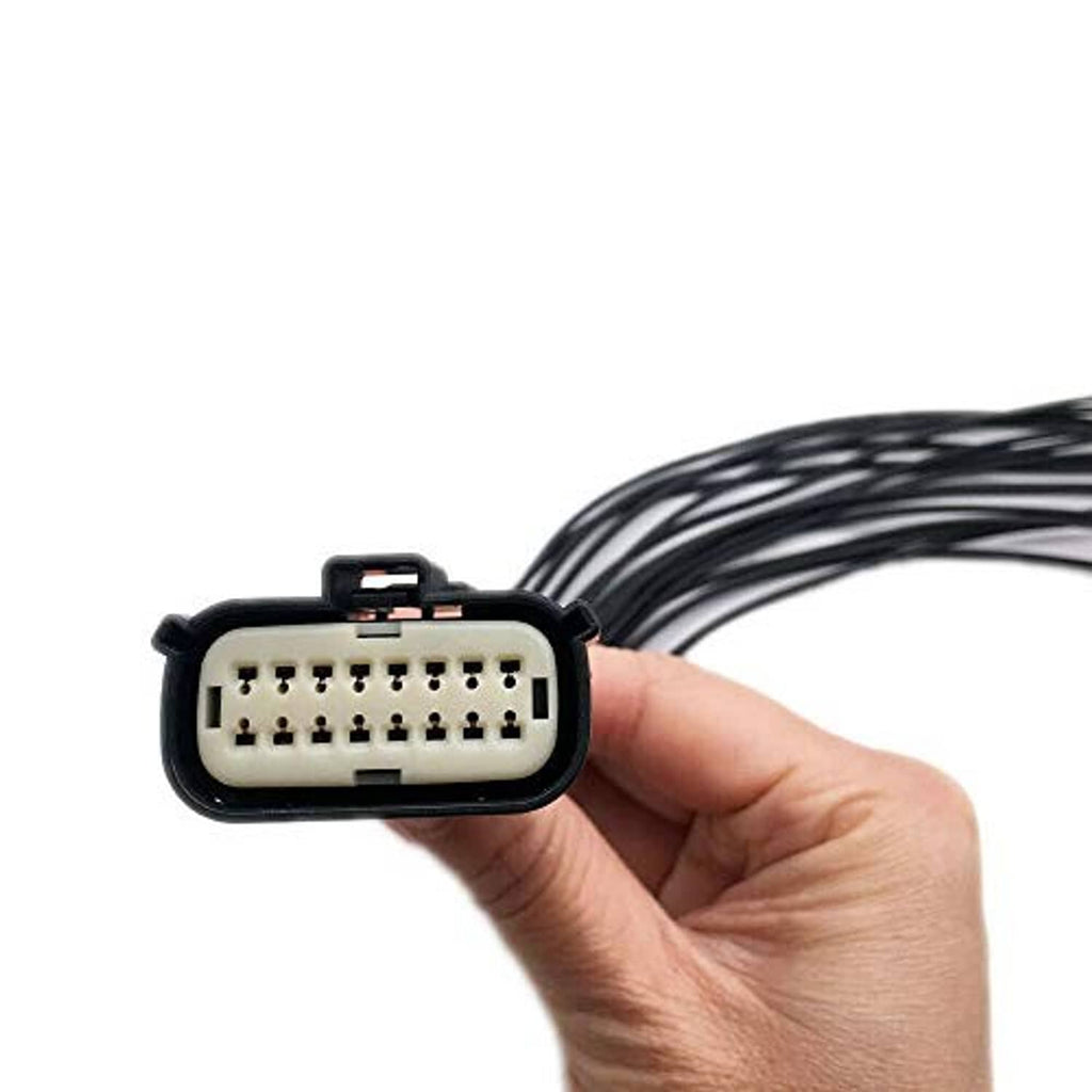 Headlight connector pigtail plug held in hand, black housing over multi-pin socket