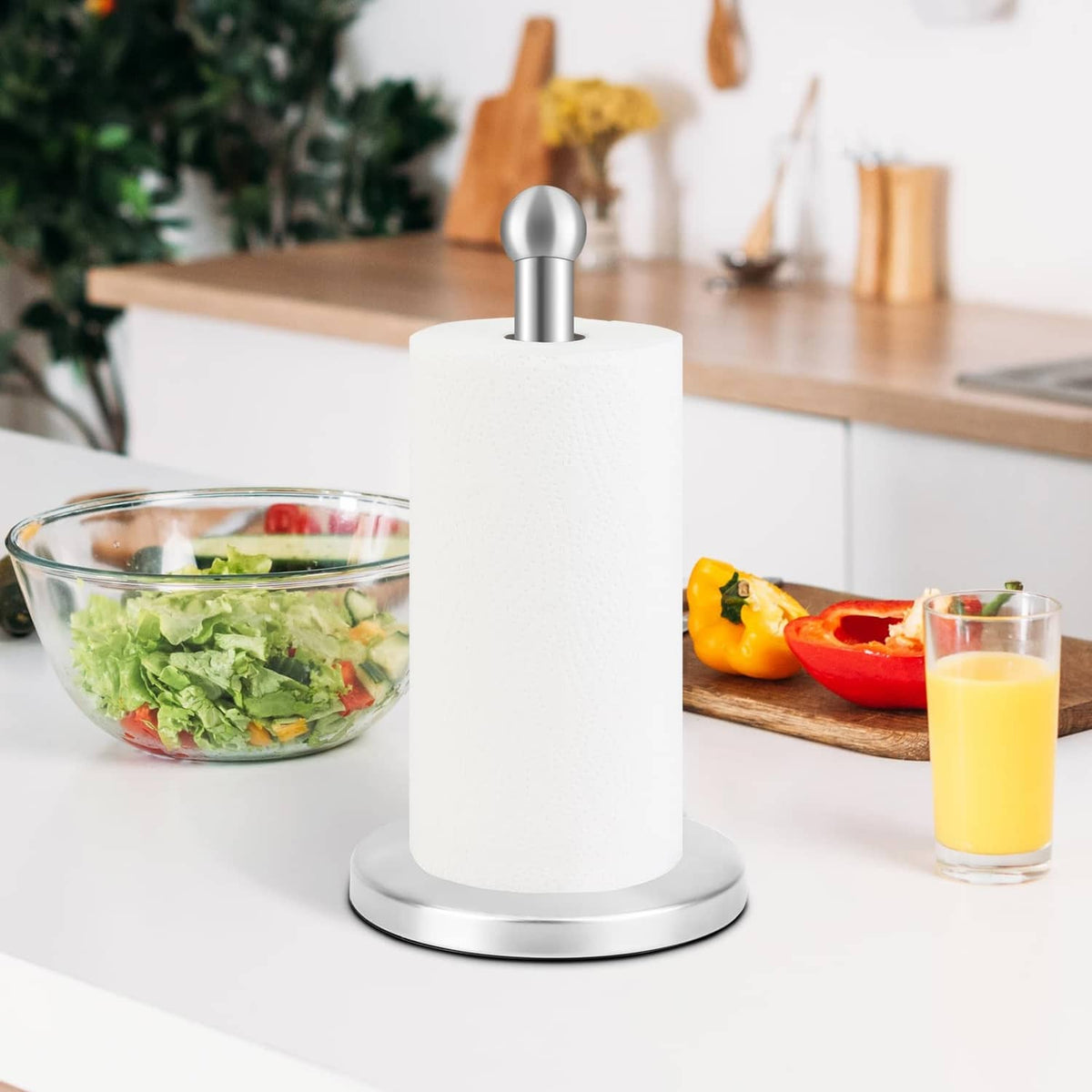 Silver countertop paper towel holder with round base and upright paper roll