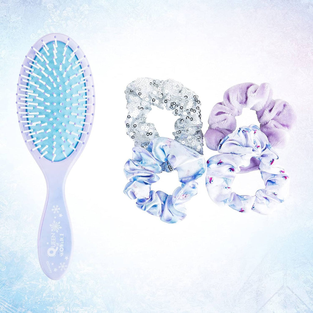 Oval hairbrush with large scrunchies in lilac velvet, silver sequins, and icy blue print