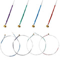 Color-coded violin strings set with gold winding: purple, green, blue, and red