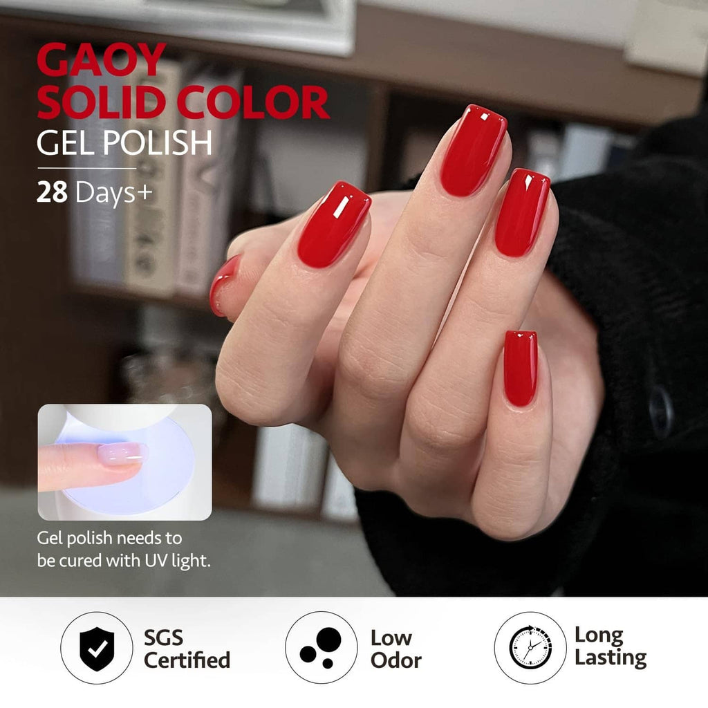 Red gel nail polish on fingers, glossy short nails with neat manicure