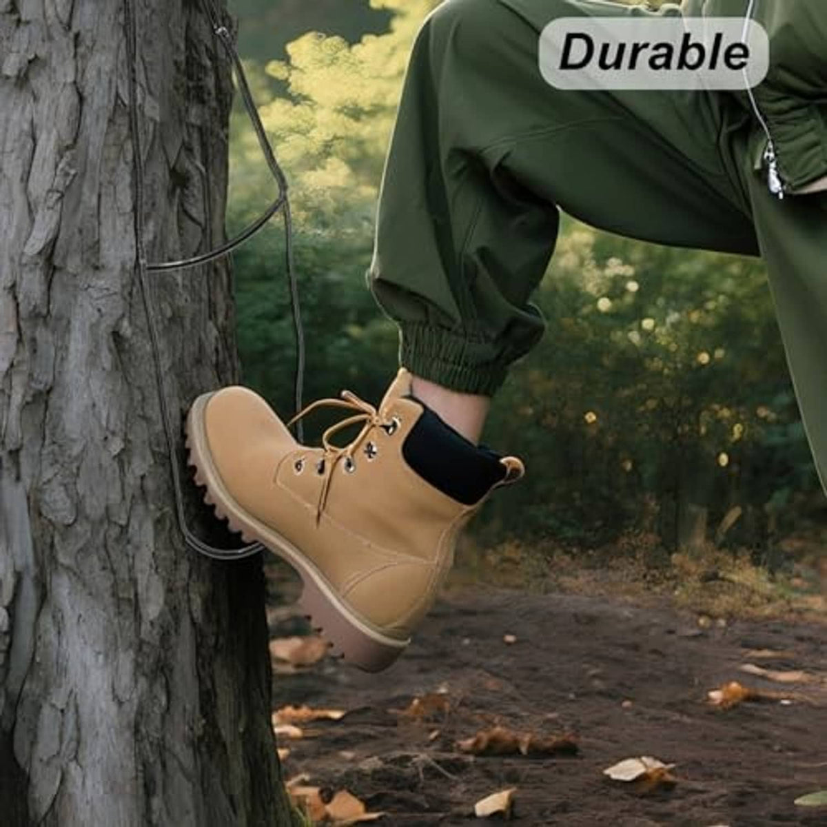 Climbing stick aider attached to a tree, with tan boot placed on the step