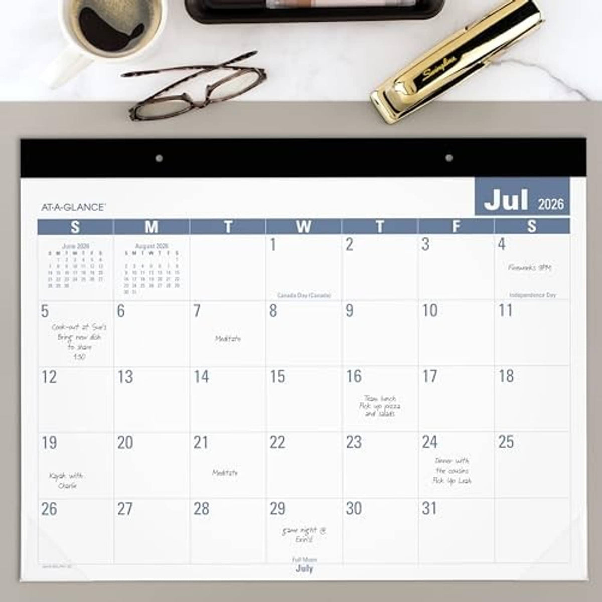 Desk monthly calendar planning pad showing July 2026 month grid on white pages