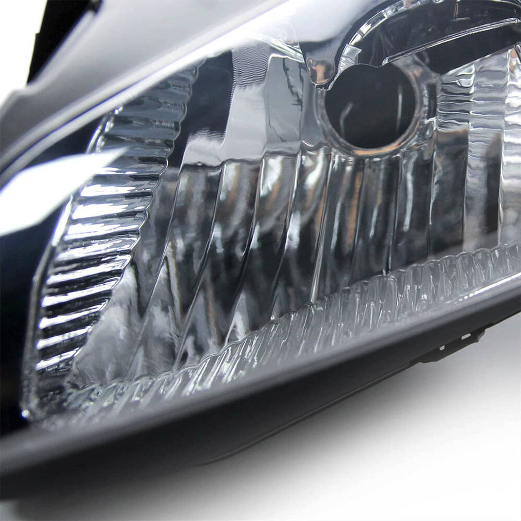 Close-up of motorcycle headlight lens and chrome reflector reflector fins