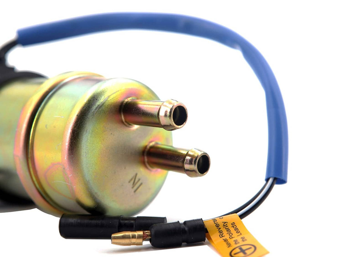 Close-up of electric fuel pump ports with blue wiring and black connector ends
