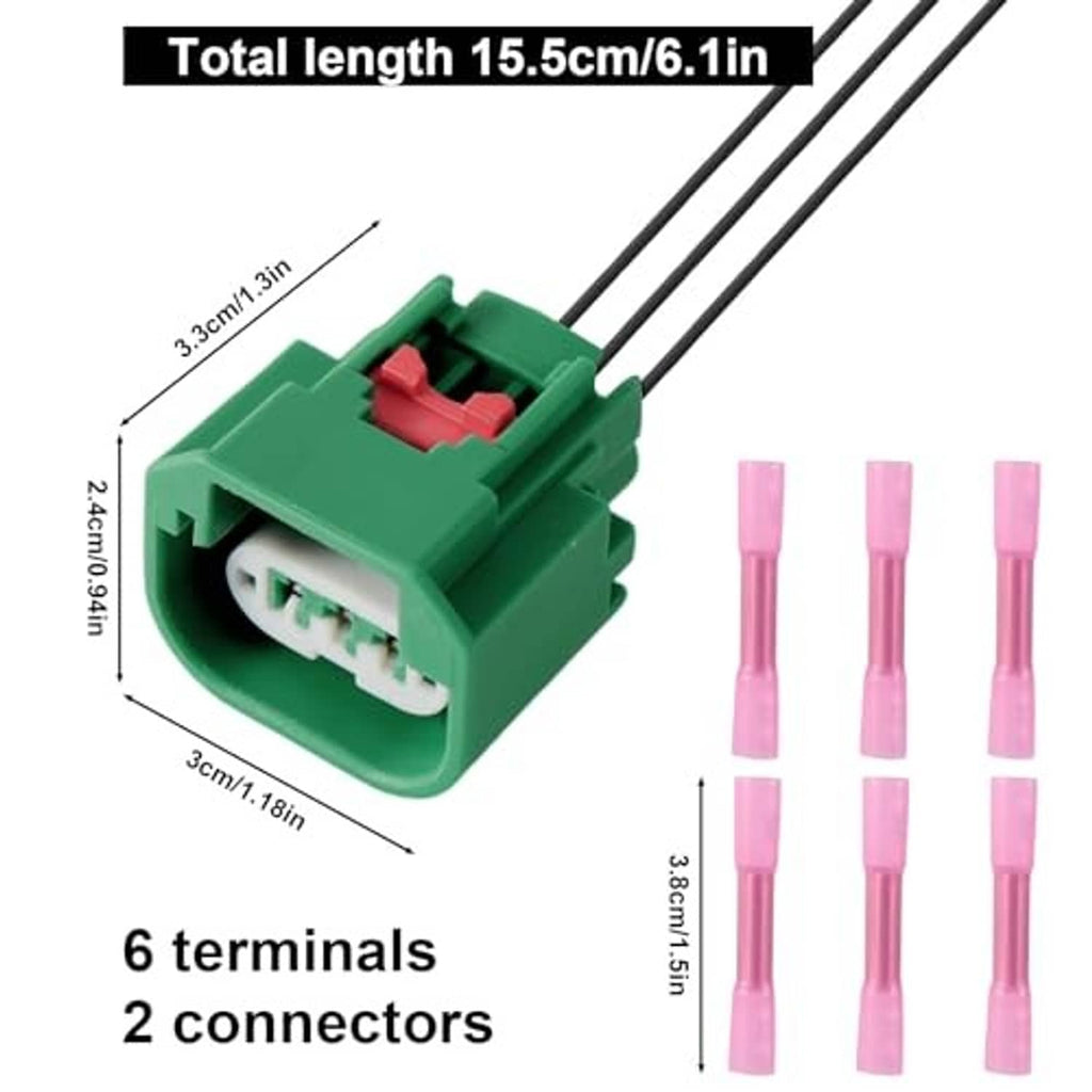 Green headlight wiring harness with 3-pin sockets, black leads, and pink terminal caps