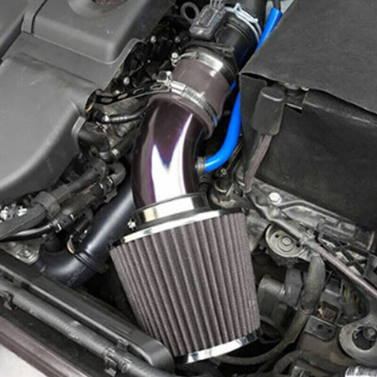Universal cold air intake kit installed: black cone air filter with blue intake piping