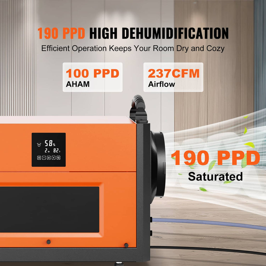 Commercial dehumidifier with orange front panel and air outlet blowing toward room.