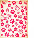 Plastic embossing folder with red paw print pattern on cream background