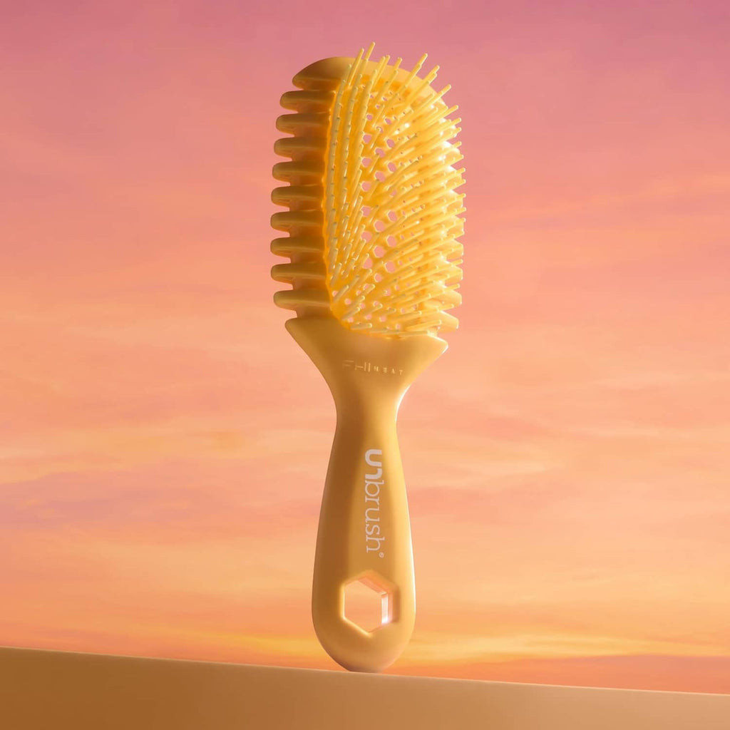 Golden hour curl brush with vented head, dense bristles, and grippy handle