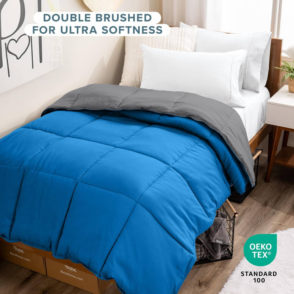 Reversible comforter on bed with blue top and grey bottom, quilted Twin XL