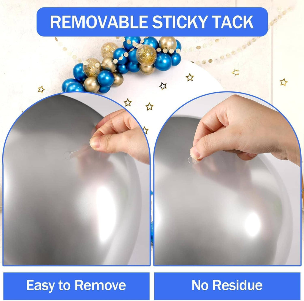 Hands mounting a small ornament using removable double-sided sticky tack dots