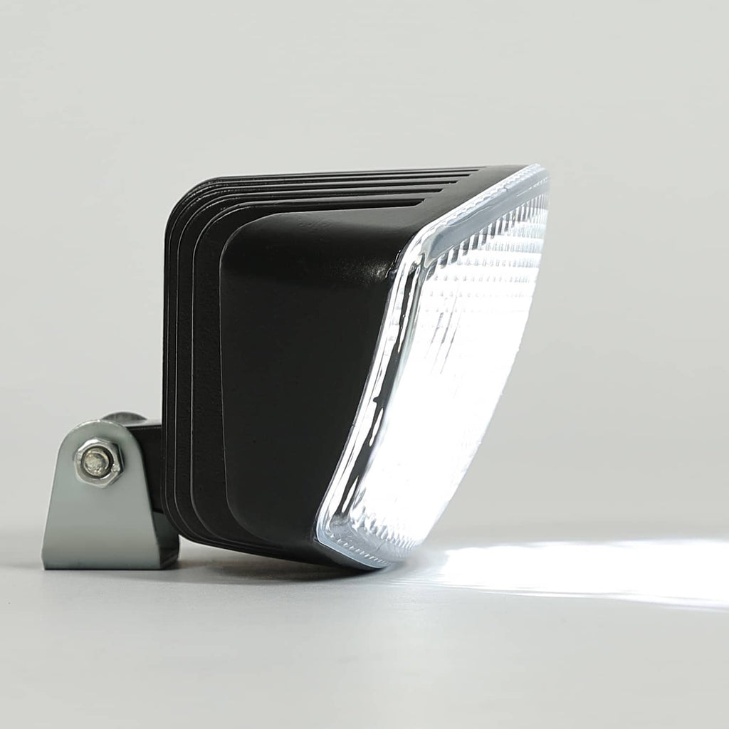 LED cab roof marker light with mounting bracket, side view, clear oval lens