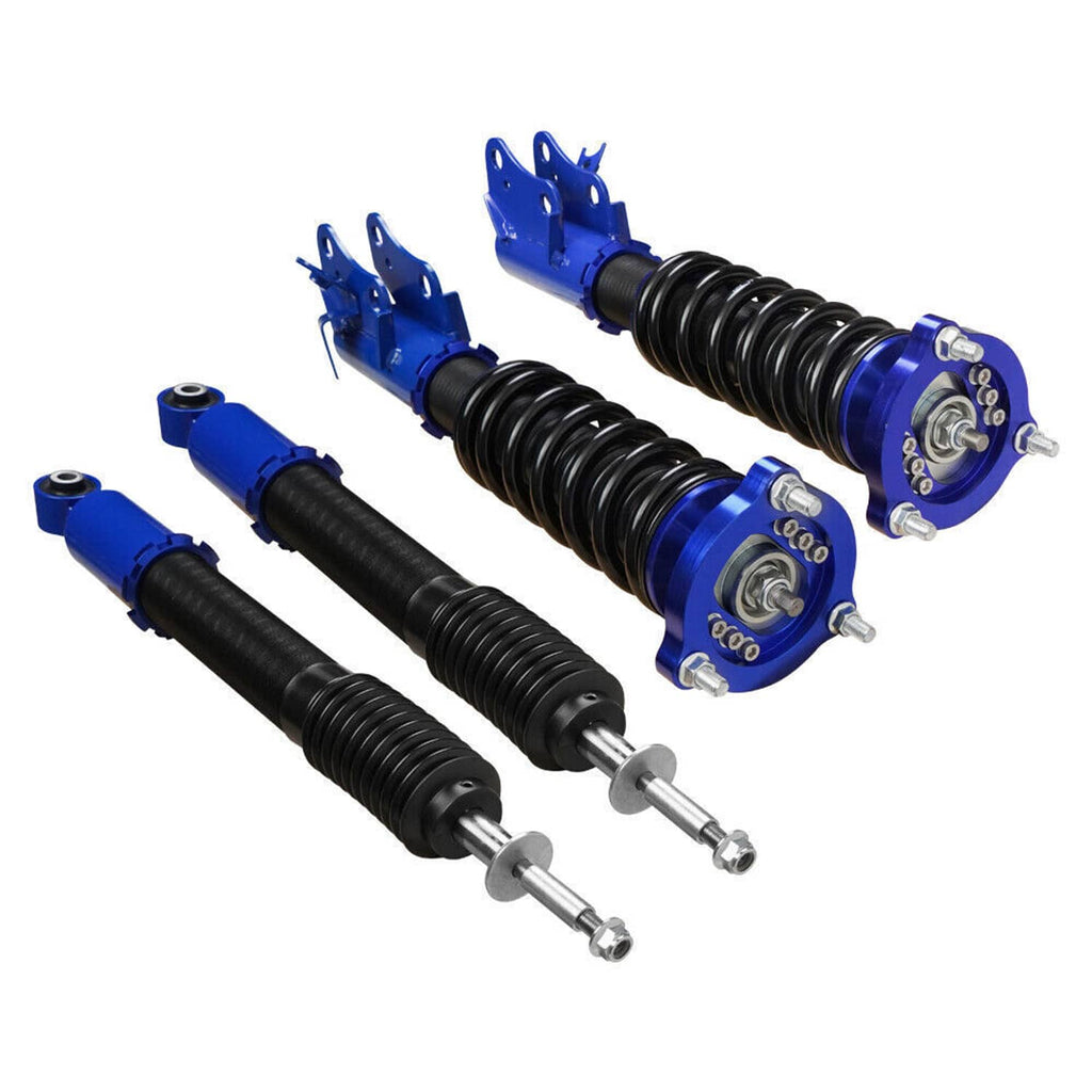 Blue coilover strut pair with black springs and top mounting plates, side angle view