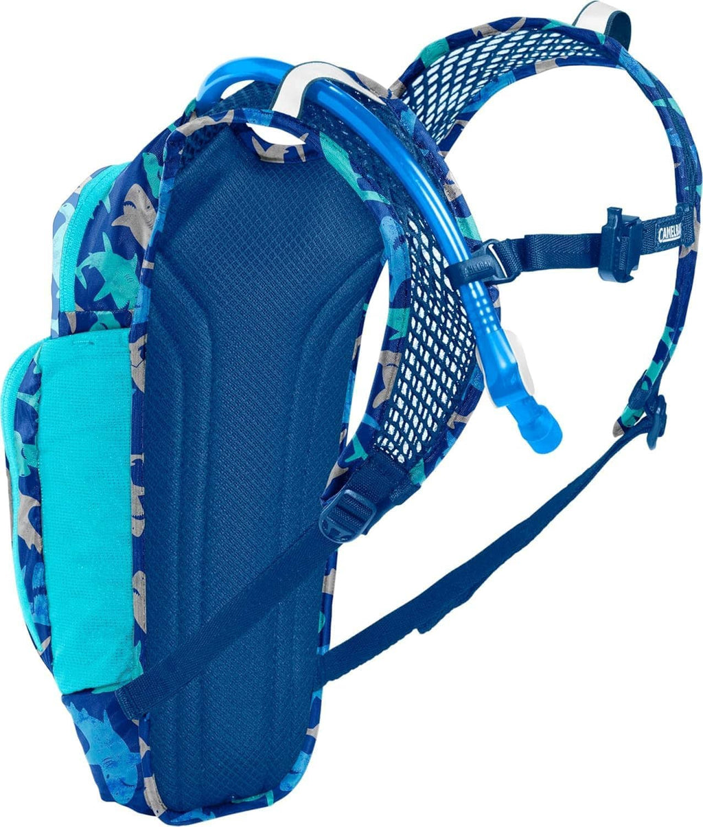 Kids hydration backpack by Camelbak, side view, blue shark print mesh panel and straps