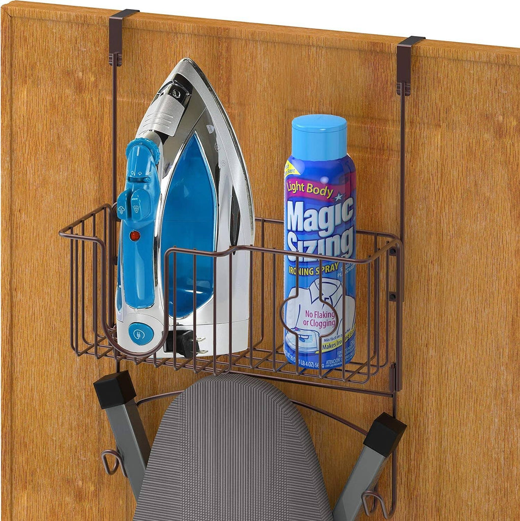 Bronze wire over-the-door organizer holding an iron, ironing board cover, and bottle