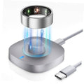 Metal charging dock with illuminated ring and attached USB-C cable for smart ring charging