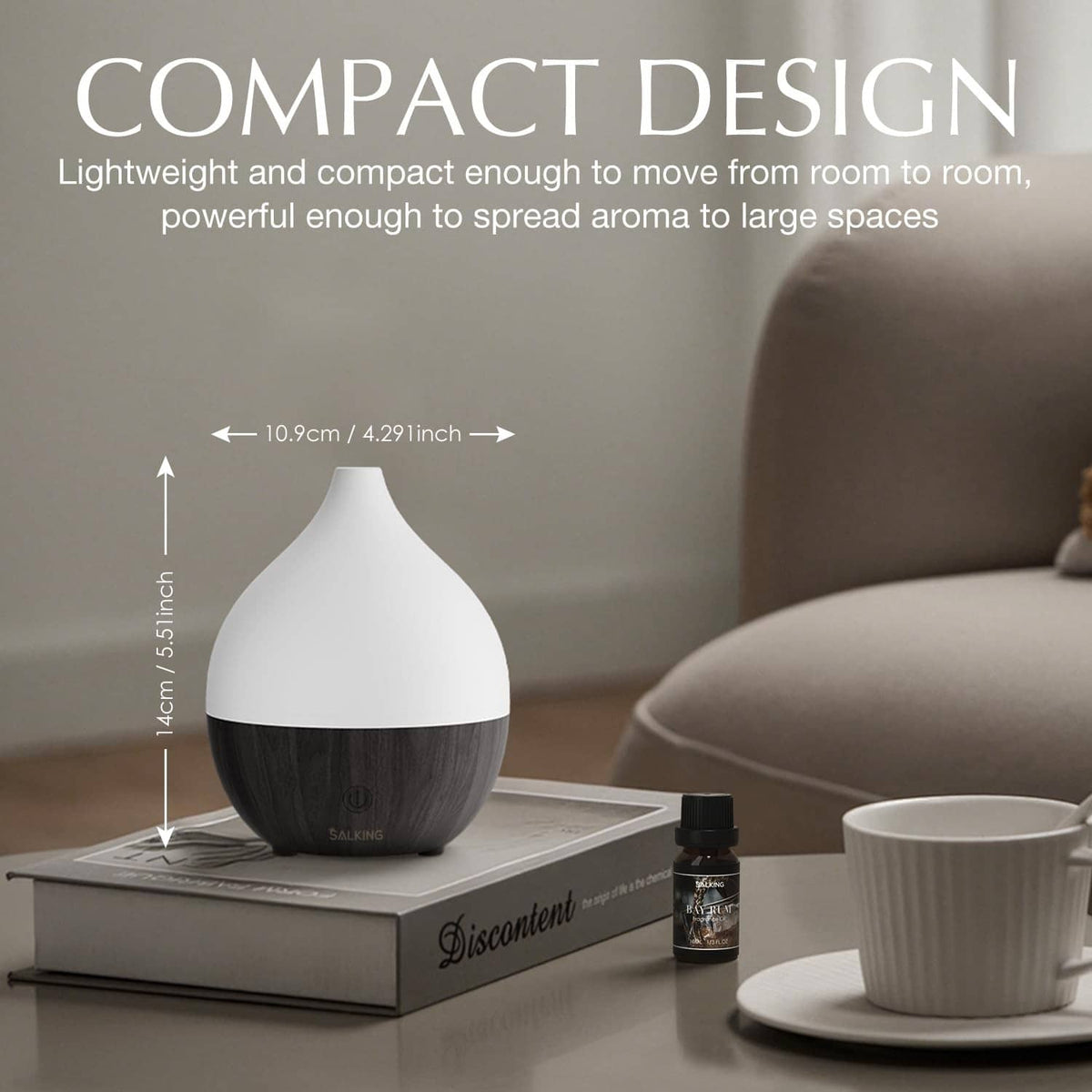 Compact ultrasonic essential oil diffuser with dark wood base and white top