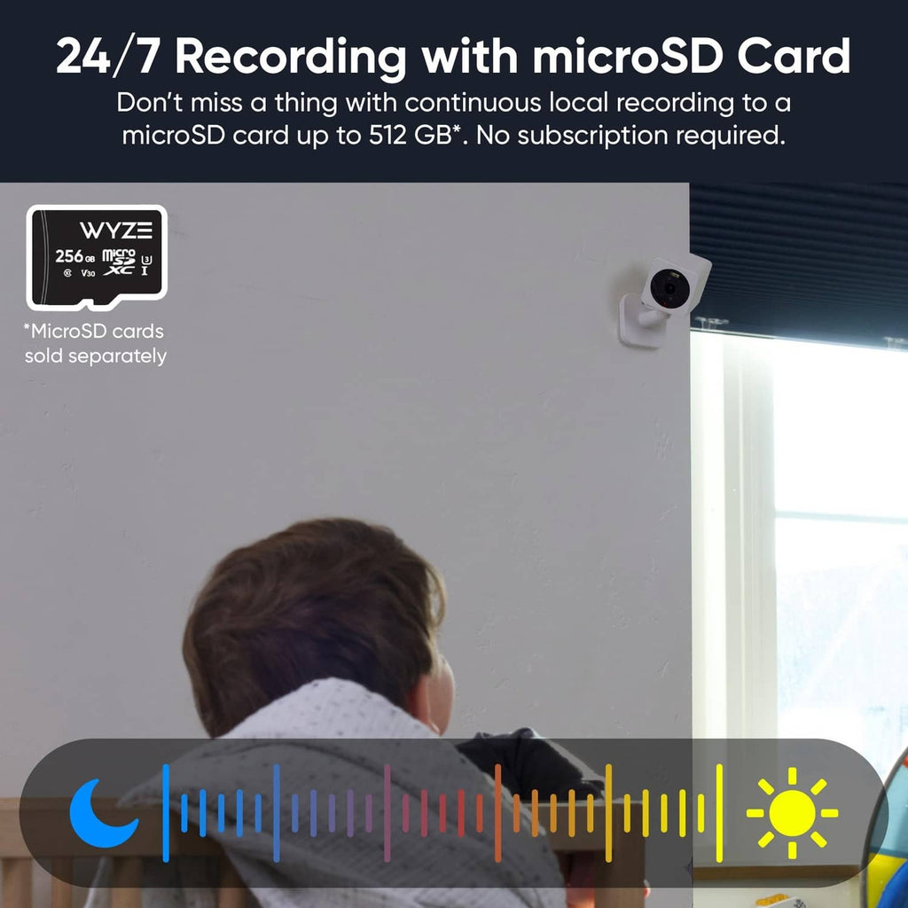 Wall-mounted white security camera with lens and glowing status indicator