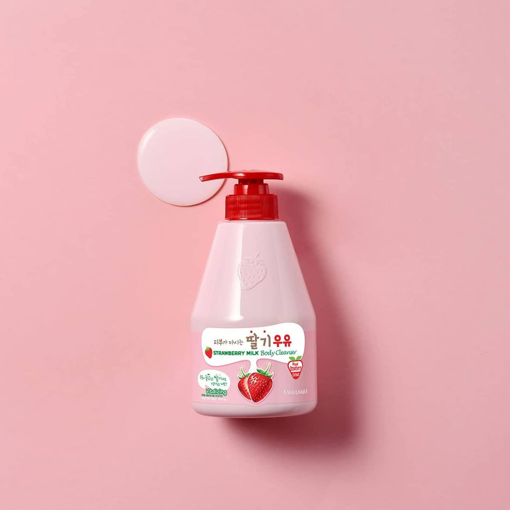 Strawberry milk body cleanser bottle with red pump on light pink background
