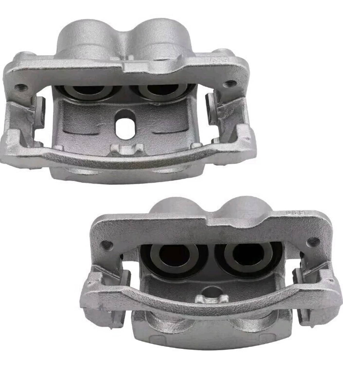 Silver front brake caliper housing pair with dual piston openings