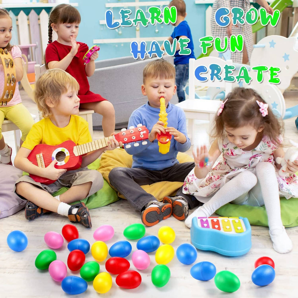Colorful plastic egg shakers scattered on the floor, red blue green yellow pink eggs
