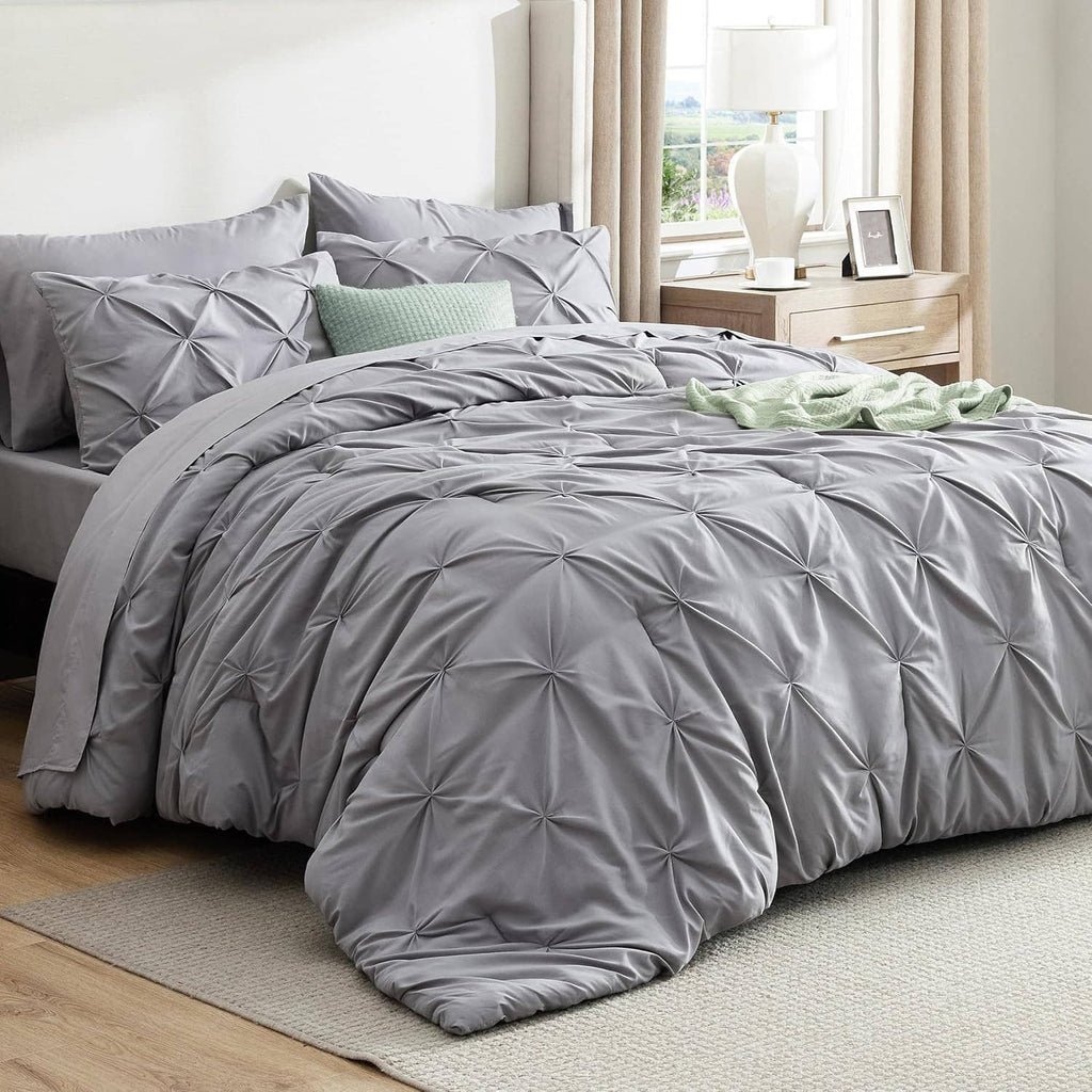 Grey queen comforter set with quilted diamond tufts and matching pillow shams