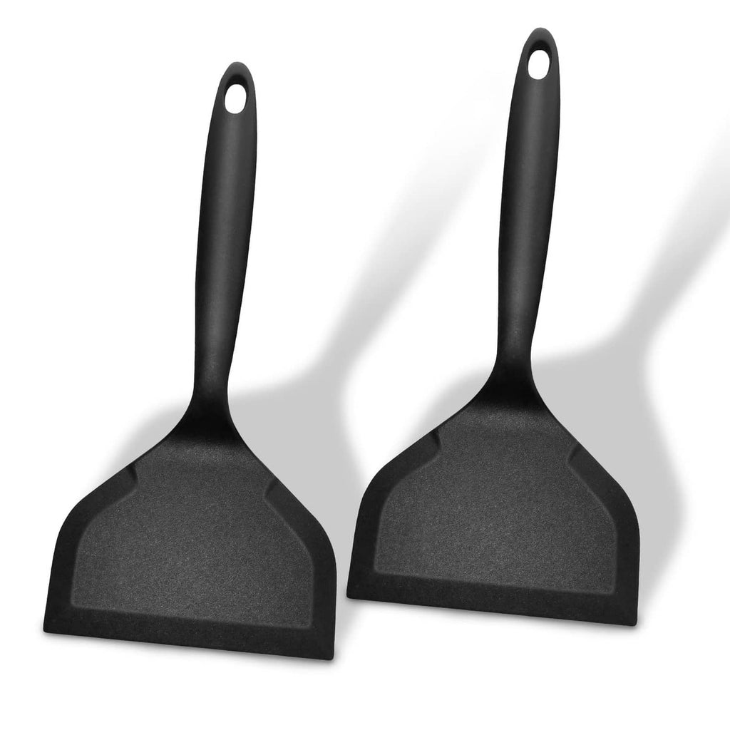Wide black silicone pancake flipper spatula, long handle with hanging loop, nonstick head