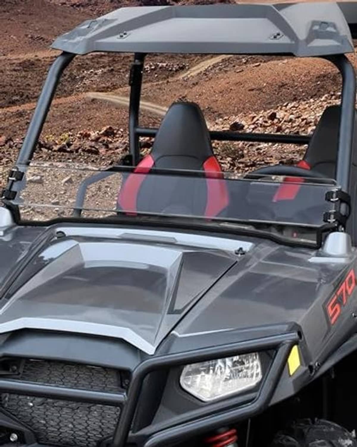 UTV front half windshield with clear panel, black clamps, and white mounting frame