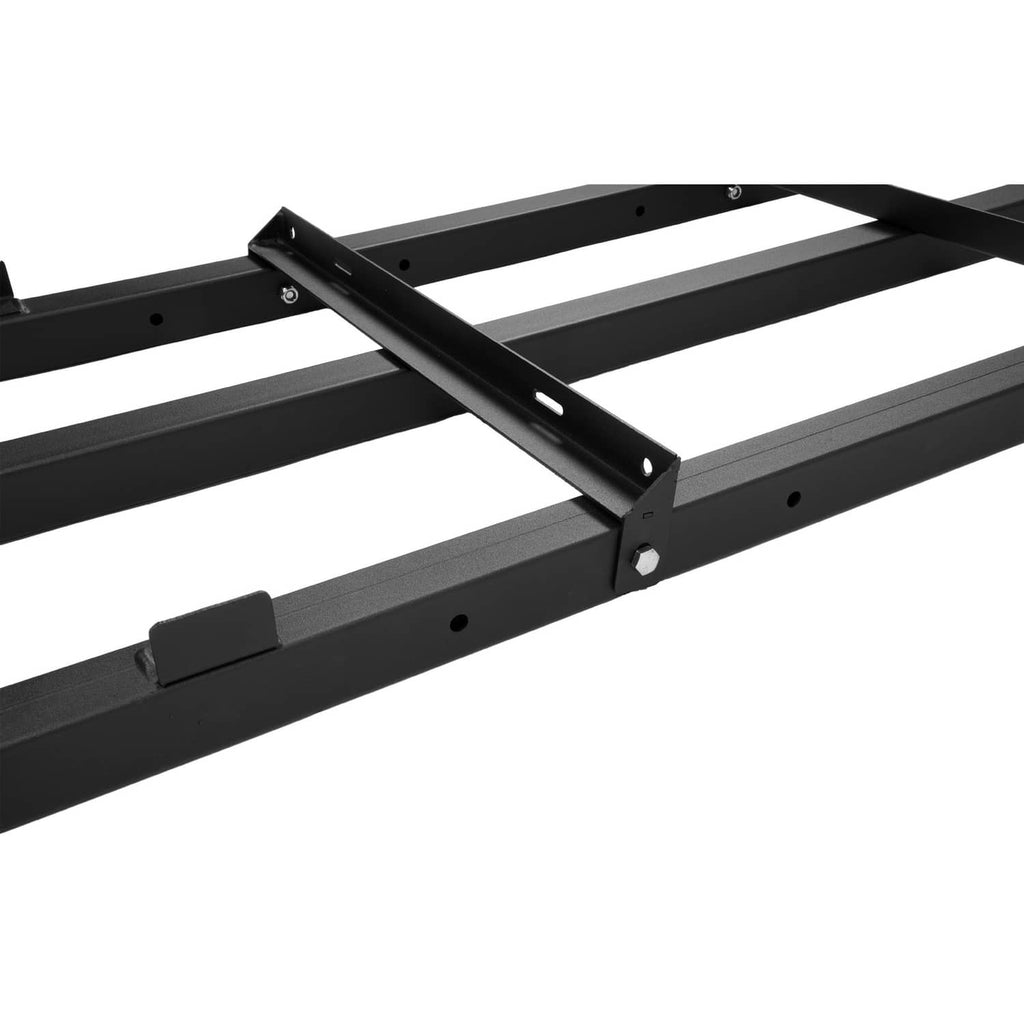 Close-up of black steel drag harrow frame with bolt holes and angled support bar