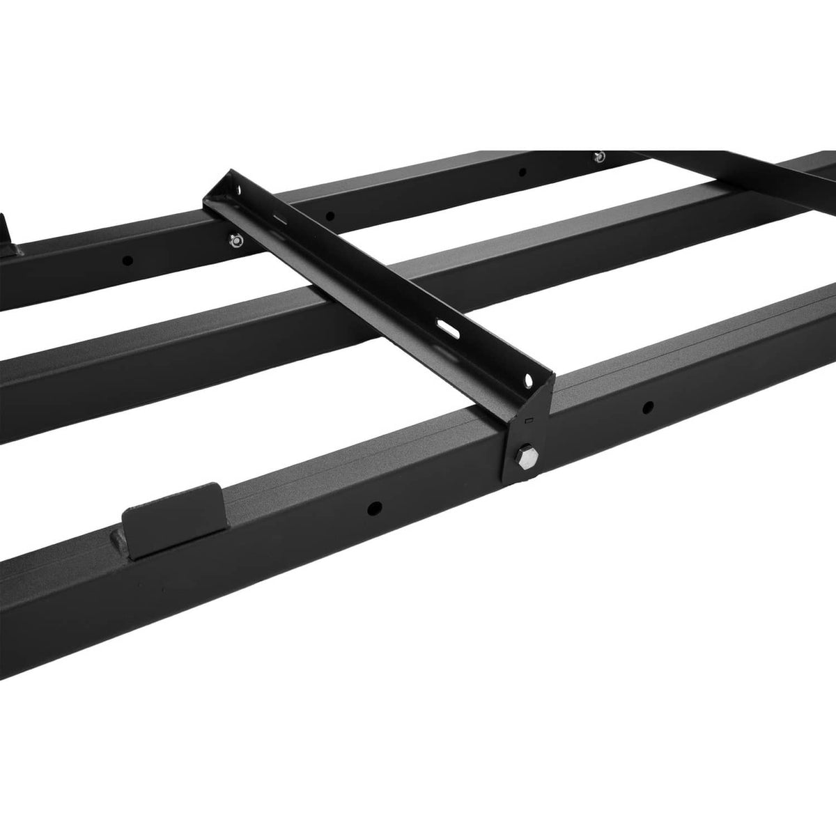 Close-up of black steel drag harrow frame with bolt holes and angled support bar
